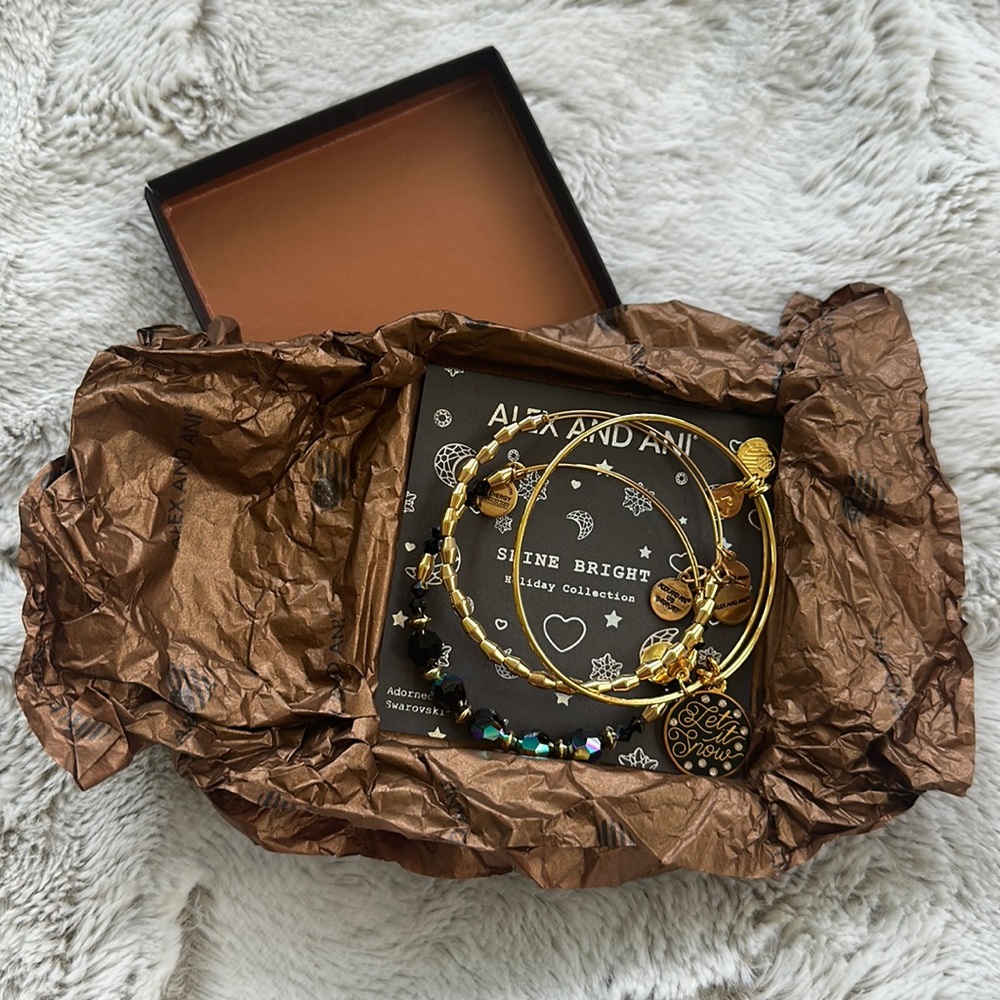 Set of 3 Alex and Ani gold holiday bracelets. Perfect condition.